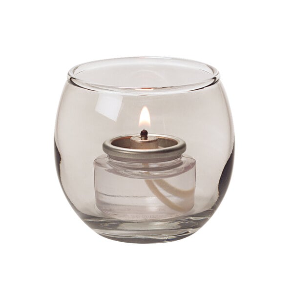 A Small Smoke Lustre Glass Bubble Tealight Lamp with a lit candle inside.