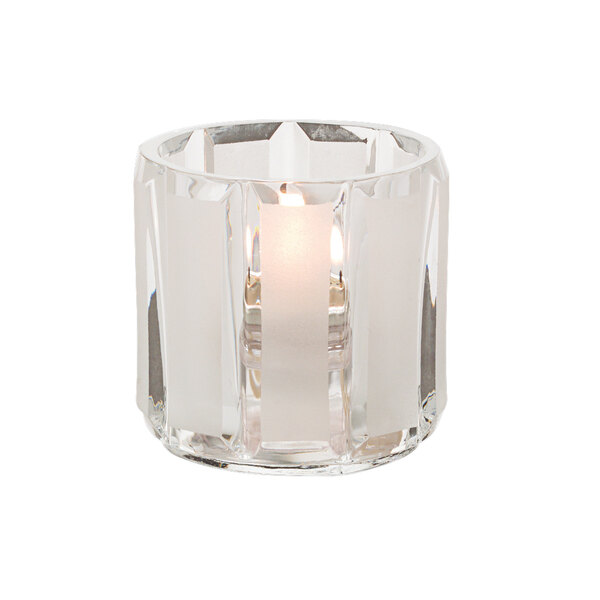 A Hollowick Crystal glass tealight candle holder with a lit candle.