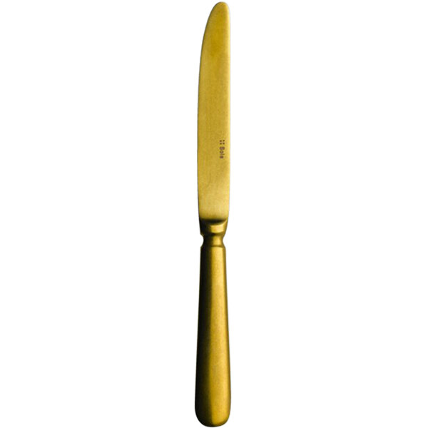 A Sola stainless steel table knife with a vintage gold handle.