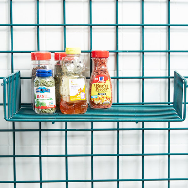 A Metro SmartWall G3 grid shelf with spices and condiments on it.