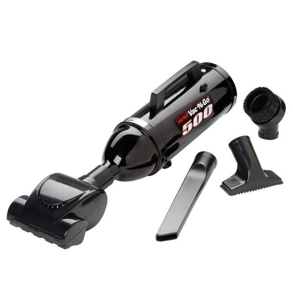 A black MetroVac Vac N Go handheld canister vacuum with a cord and nozzles.