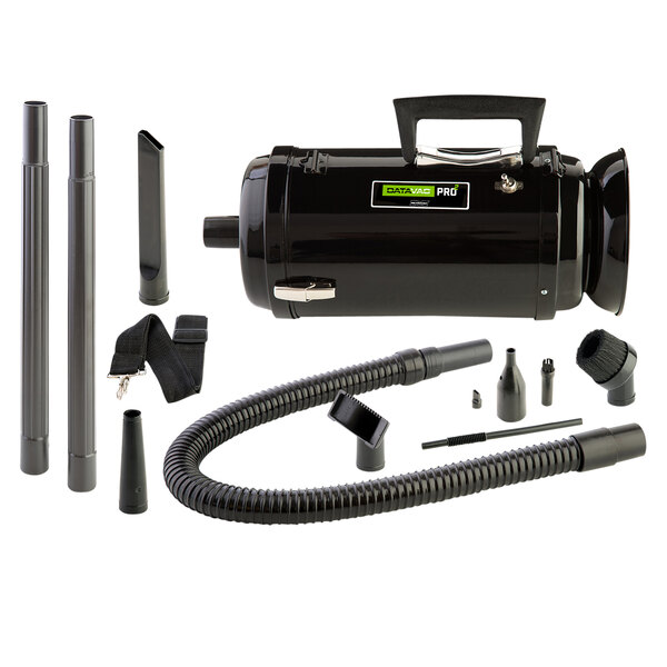A black MetroVac canister vacuum with accessories including tubes and a hose.