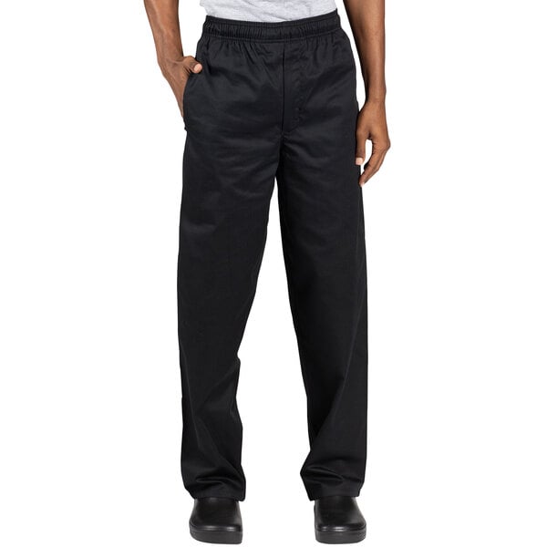 A person wearing Uncommon Chef black chef pants.