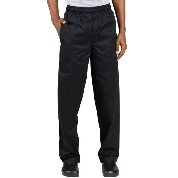 A man wearing Uncommon Chef black chef pants.