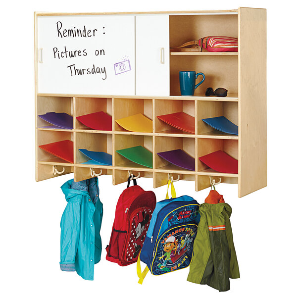 A Jonti-Craft wall mount coat locker with backpacks and school bags inside.