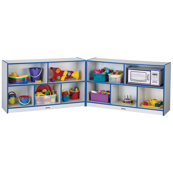 A blue and white Rainbow Accents mobile storage cabinet filled with toys.