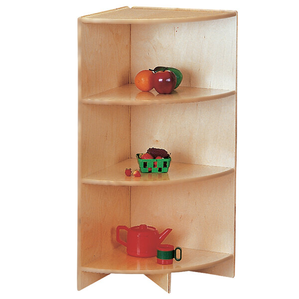 A Jonti-Craft wooden corner shelf with fruit and vegetables on it.