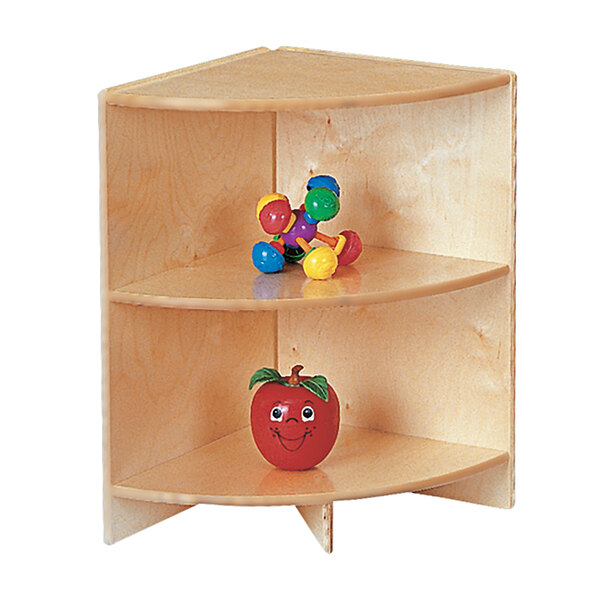 A Jonti-Craft wooden toddler-height corner shelf with toys on it.
