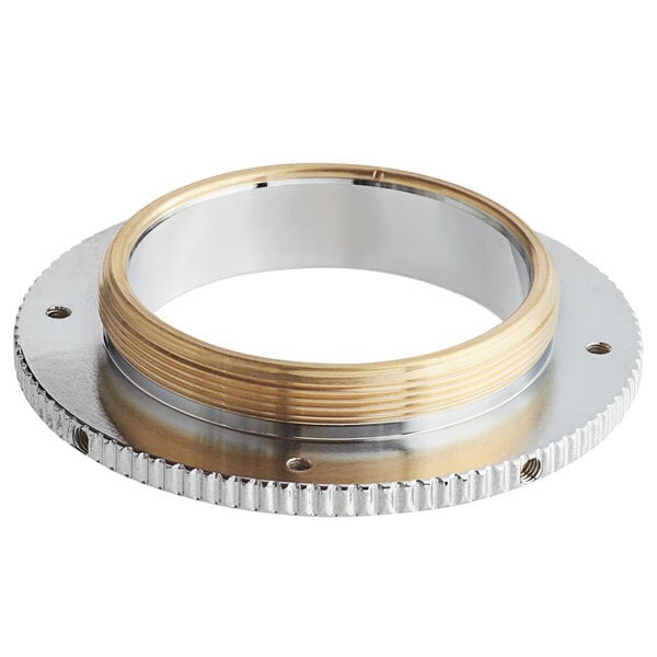 A round metal grind selector plate with silver and gold rings.