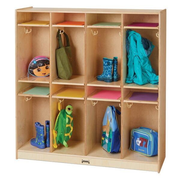A Jonti-Craft wooden classroom locker with different colored bags hanging on it.