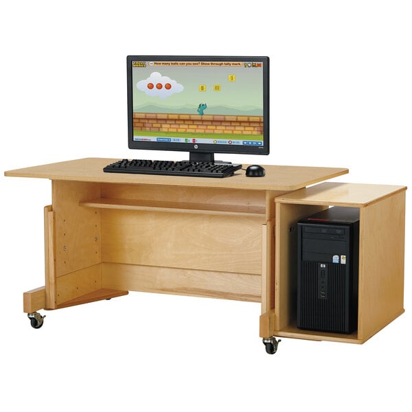 A Jonti-Craft adjustable height computer desk with a maple laminate top.