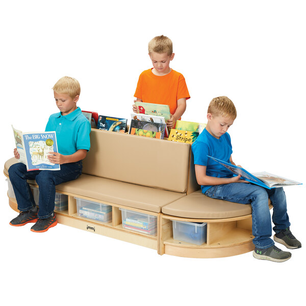 Three kids sitting on a Jonti-Craft Read-a-Round bench reading books with clear tubs on the side