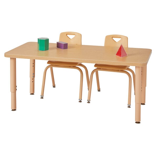 A Jonti-Craft rectangular table with chairs and a stack of books on it.