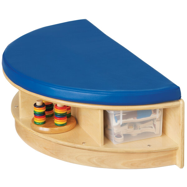 A Jonti-Craft semi-circle wooden seat with blue cushion and clear trays.