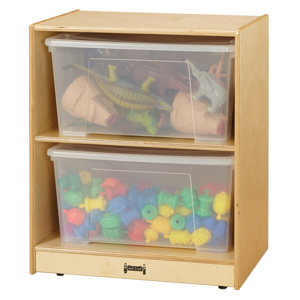A Jonti-Craft wooden storage cabinet with clear plastic totes on shelves.