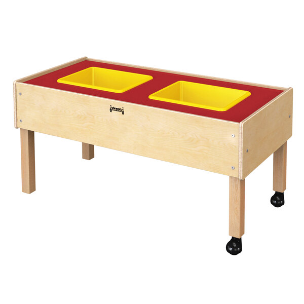 A wooden table with yellow bins on it.