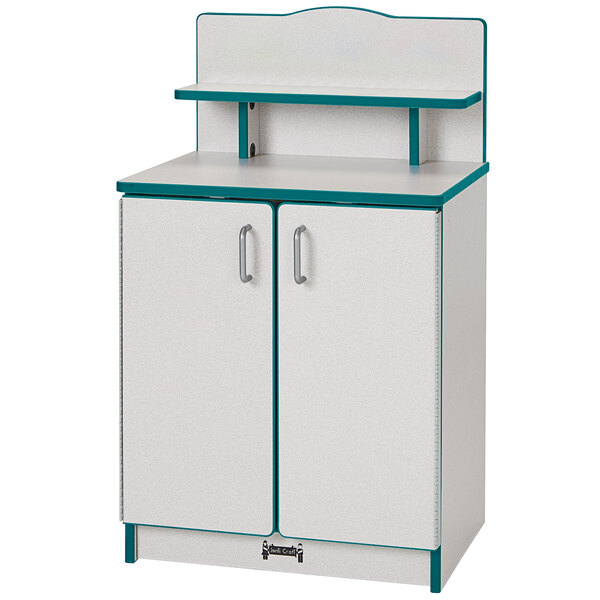 A teal kitchen cupboard with white and blue accents and two doors.