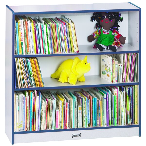 A Rainbow Accents navy bookcase with shelves of books and stuffed animals.