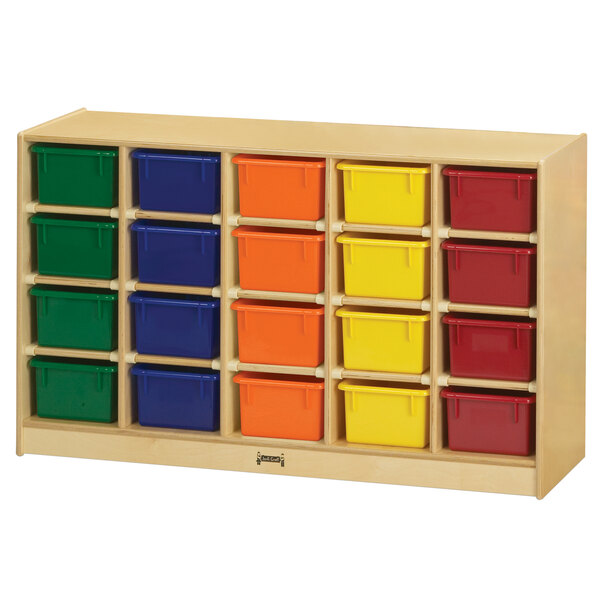 A Jonti-Craft wooden storage unit with many different colored bins on a wood surface.