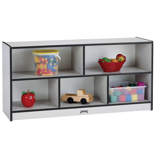 A white and gray Rainbow Accents toddler-height storage unit with toys.
