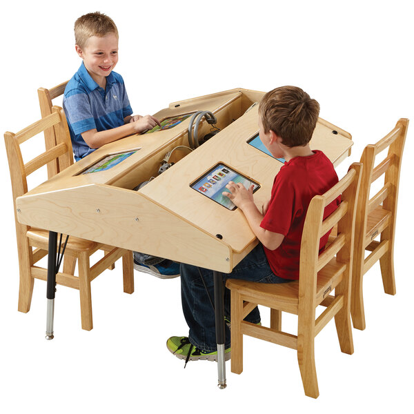 Two children using Jonti-Craft wood tablets at a table with storage.