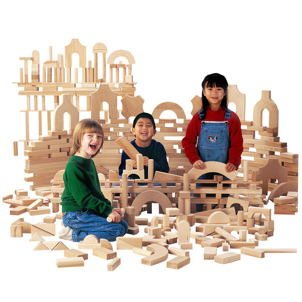 A group of children playing with the Jonti-Craft Children's Junior Hardwood Unit Block Set.