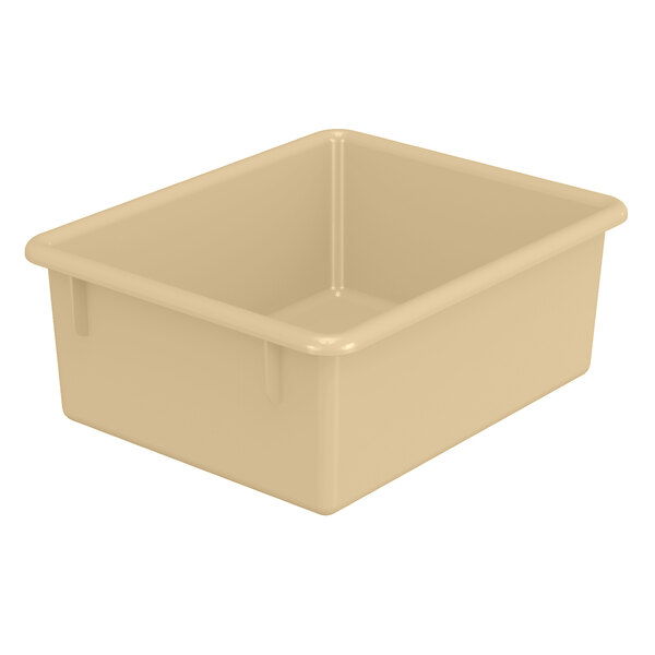 An almond plastic cubbie tray for classroom storage.
