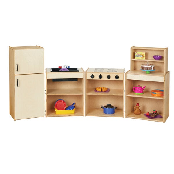 A wooden Young Time toy kitchen with shelves.