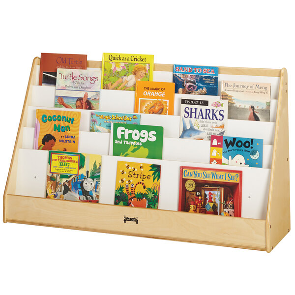 A wooden Jonti-Craft extra wide book rack with many books on it.