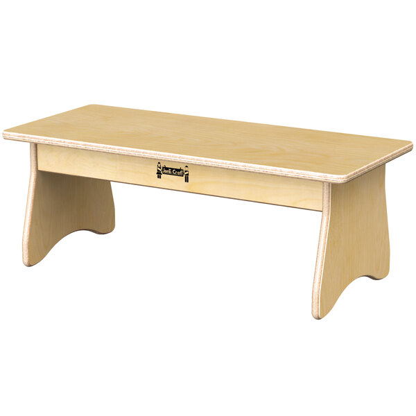 A wooden Jonti-Craft children's table with a shelf above the legs.