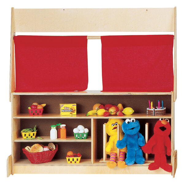 A Jonti-Craft wooden toy store with red curtains.