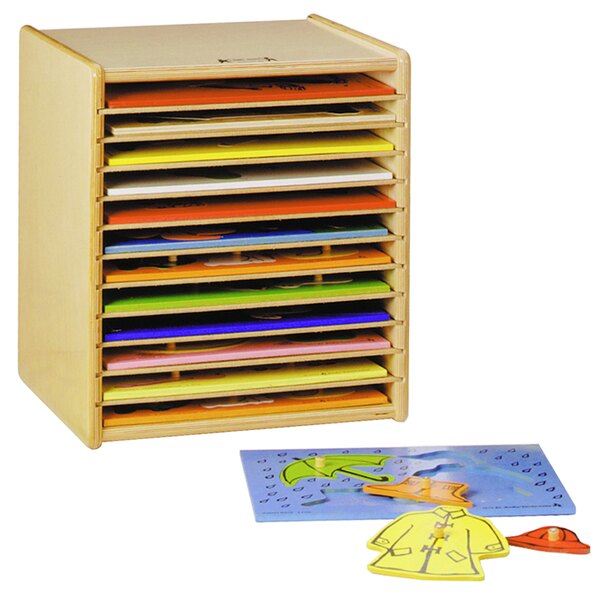 A Jonti-Craft wooden puzzle case filled with many puzzle pieces.
