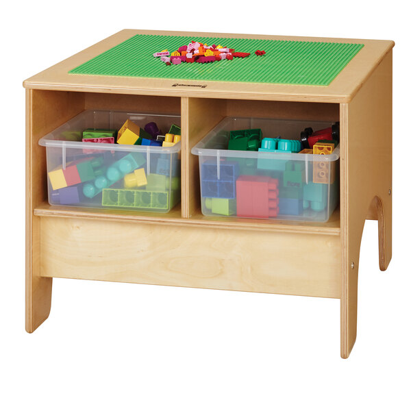 A wooden Jonti-Craft table with green plastic bins on a green base.