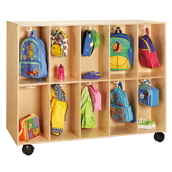 A Jonti-Craft wooden mobile double-sided backpack locker with children's backpacks inside.