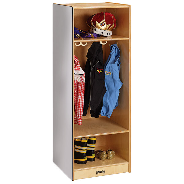 A Jonti-Craft Baltic Birch wooden locker with clothes and hats.