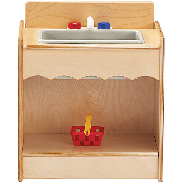 A Jonti-Craft wooden toddler kitchen sink with a red basket.