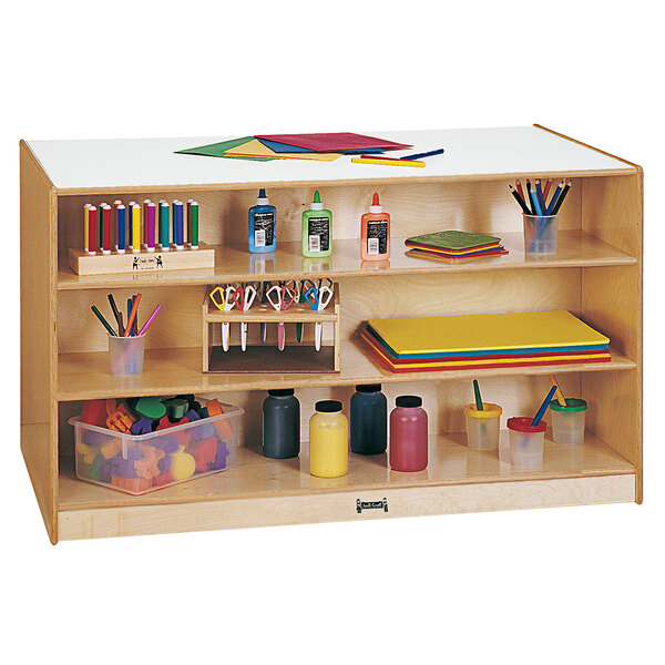 A Jonti-Craft mobile storage island with colored trays holding a variety of supplies.