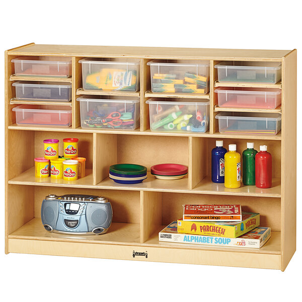 A Jonti-Craft wooden storage unit with clear plastic trays filled with toys.