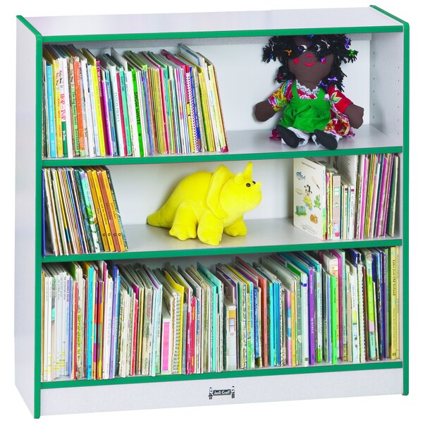 A Rainbow Accents teal bookcase shelf with books and stuffed toys.