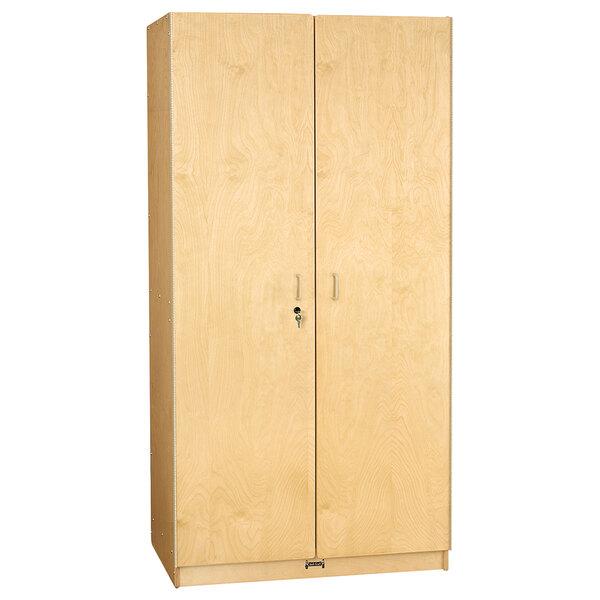 A Jonti-Craft wooden cabinet with a lock and two doors.