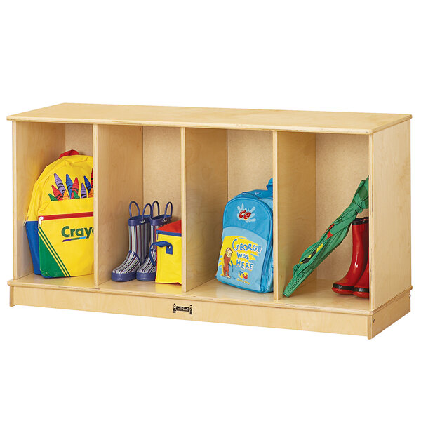 A Jonti-Craft stackable open locker with a blue backpack and yellow jacket filled with school supplies.