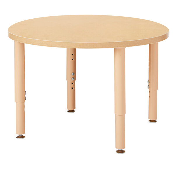 A Jonti-Craft round wooden table with legs.