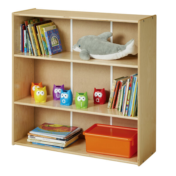 A wooden Young Time short bookcase with toys and books on it.