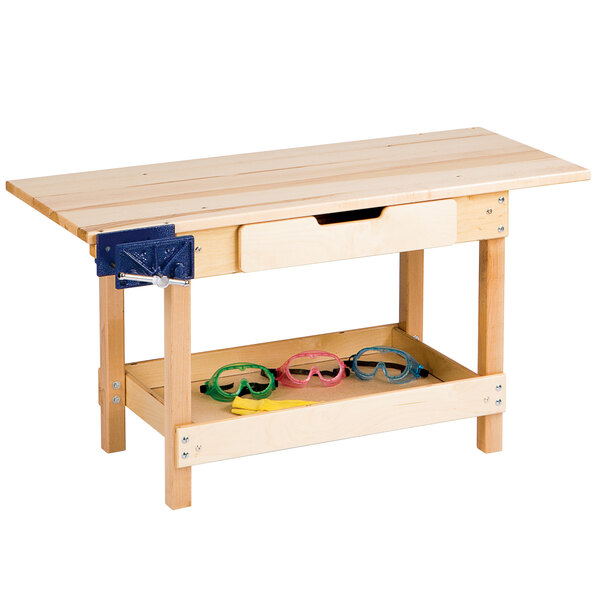 A Jonti-Craft wooden workbench with safety glasses on it.