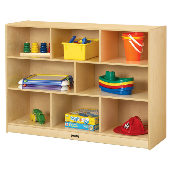 A Jonti-Craft wooden storage unit with toys and objects on the shelves.