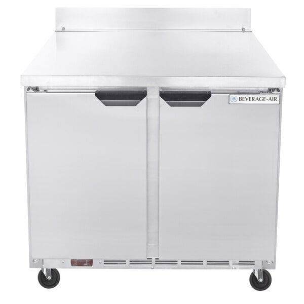 A silver Beverage-Air worktop refrigerator with two doors.