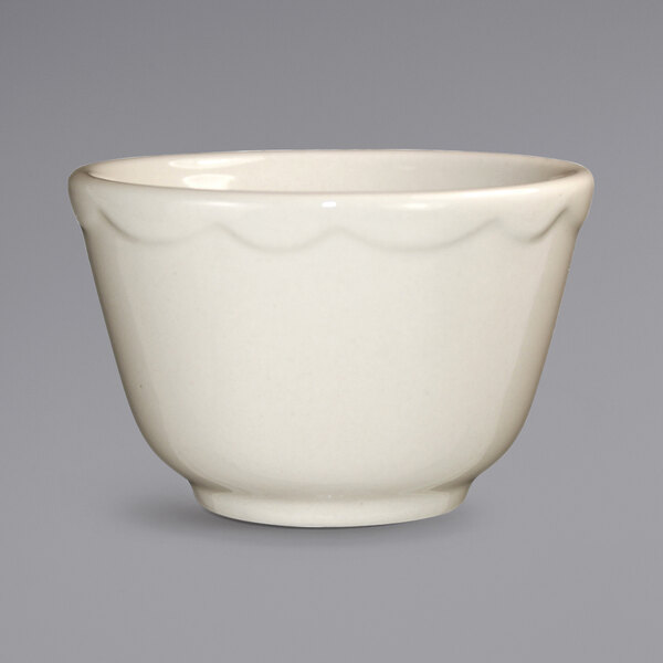 A white International Tableware Victoria stoneware bowl with a scalloped edge.
