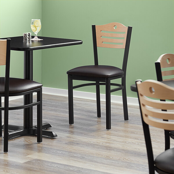 Lancaster Table & Seating Black Finish Bistro Chair with 2 1/2" Dark Brown Vinyl Padded Seat and Natural Wood Back