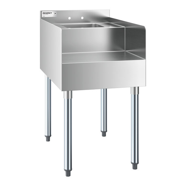 A stainless steel station with four legs, a raised back and sides, and a small integrated sink.
