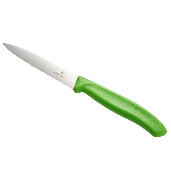 A Victorinox paring knife with a green handle.